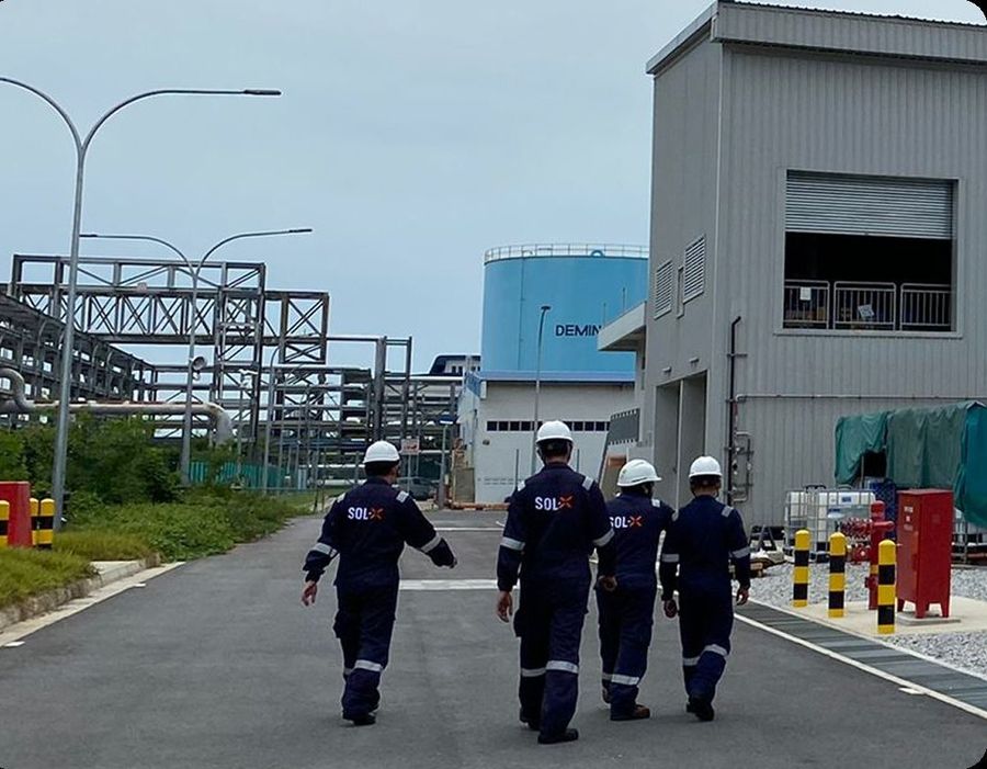 Team walking through an industrial site during a site visit